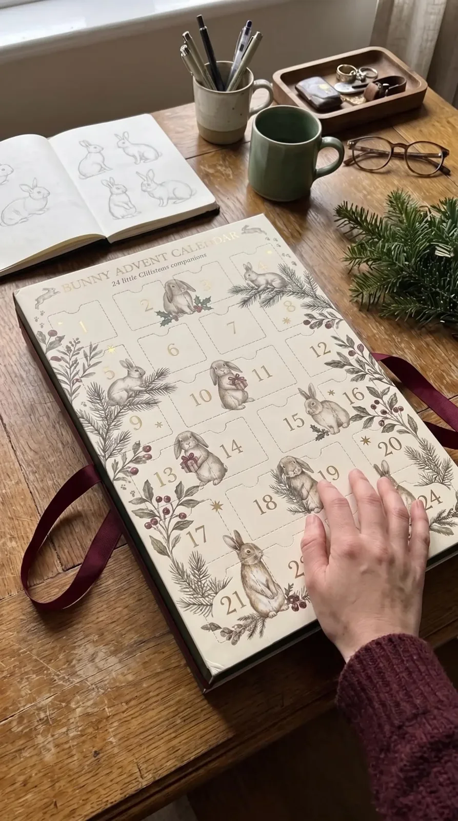 Illustrated bunny calendar on an oak desk